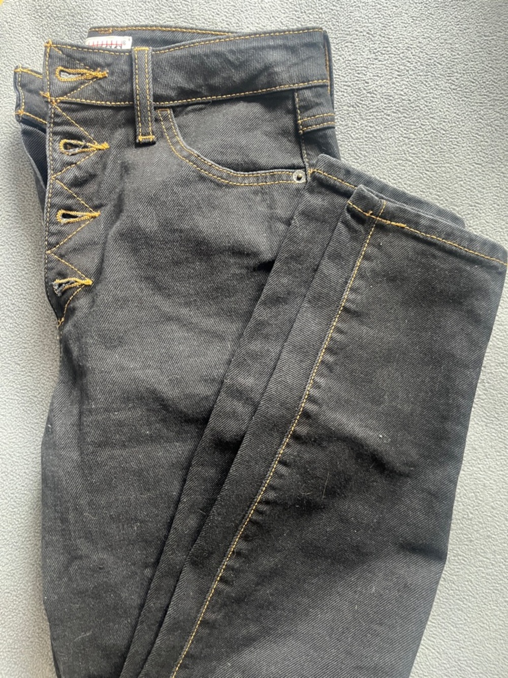 Guess High-Rise Button-Fly Jeans in Black with Gold Stitching